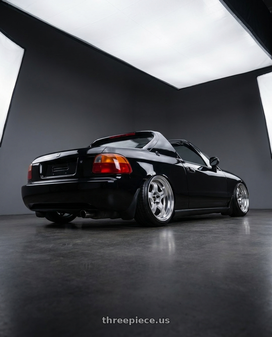1994 honda del sol with Work Meister S1 2P 4x100 15x8+38 O Disk Silver wheels rear three quarter view slight stretch tires