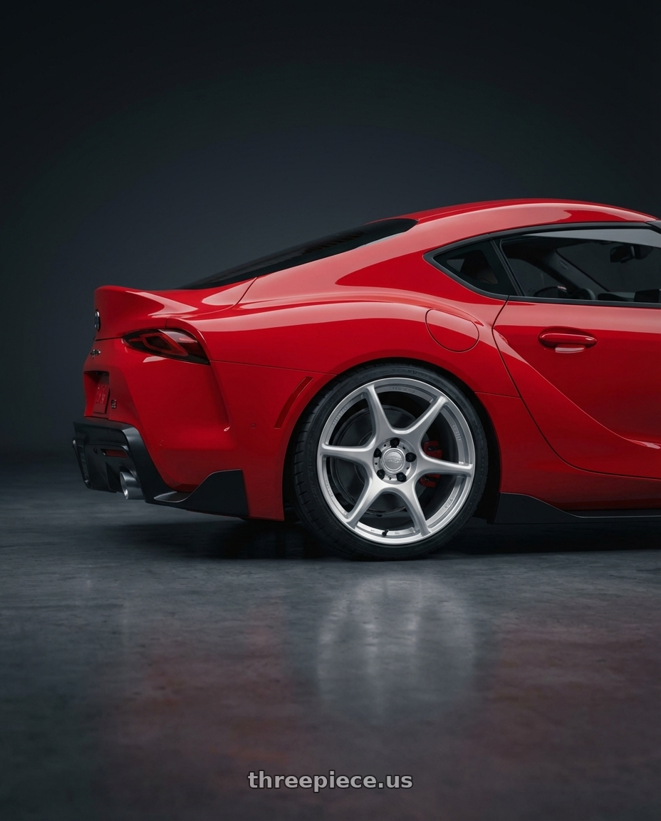 2023 Toyota GR Supra with Kansei K11S Tandem 5X112 19x10.5 22 Hyper Silver wheels rear three quarter view square tires