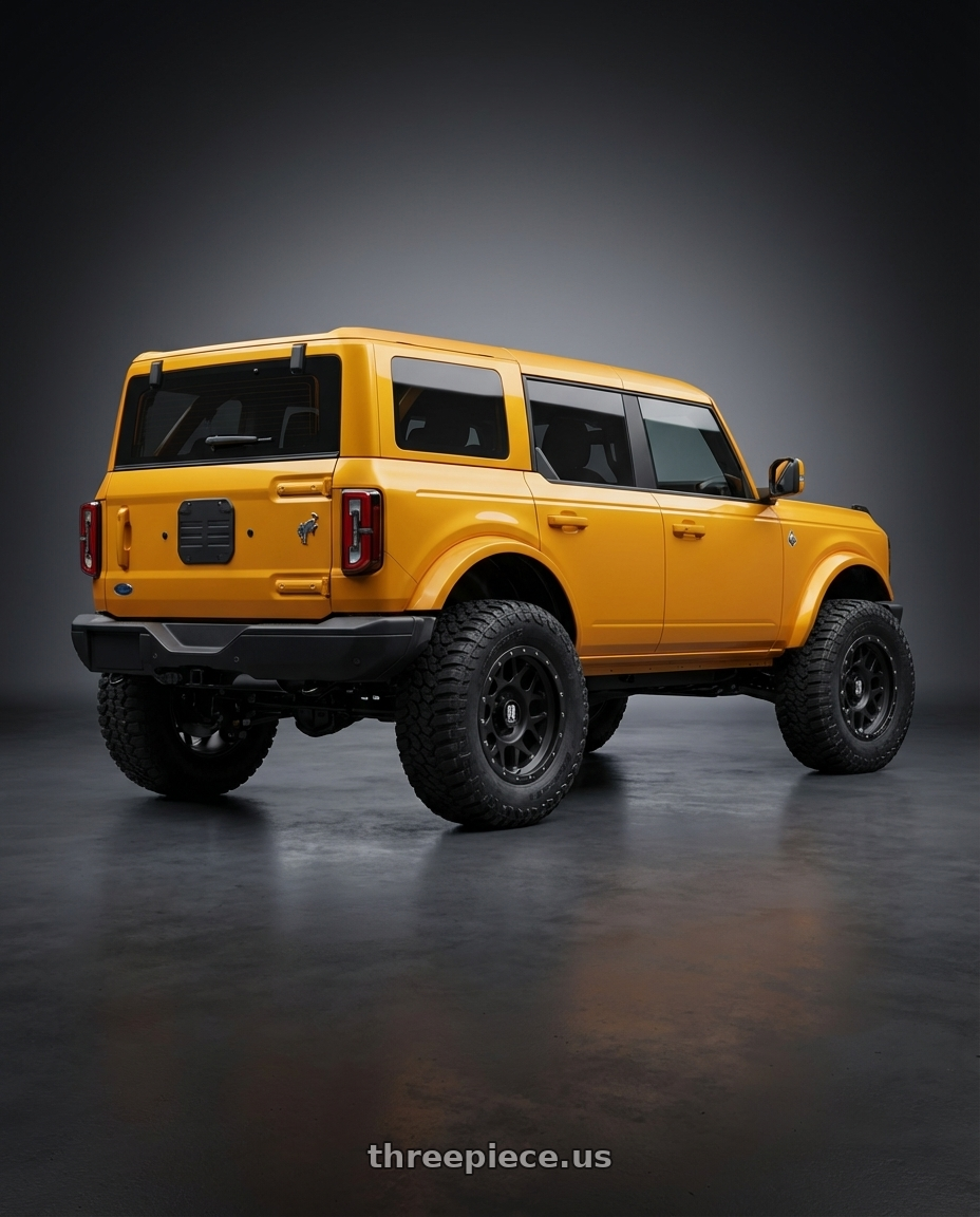 2024 Ford Bronco with XD XD127 BULLY 6X139.7 20X9 +18 SATIN BLACK WITH REINFORCING RING wheels rear three quarter view meaty tires