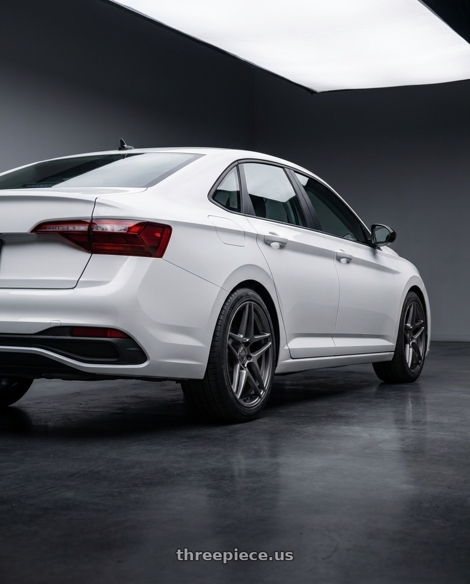 2026 vw jetta with Kansei K15G Astro 5X112 19x8.5 35 Gunmetal wheels rear three quarter view square tires