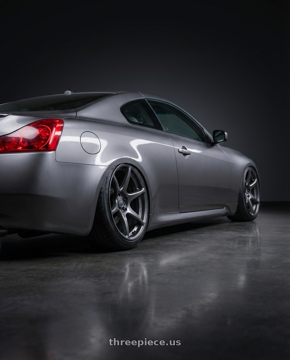 2011 Infiniti g37 with Kansei K11G Tandem 5x114.3 19x10.5 12 Gunmetal wheels rear three quarter view slight stretch tires