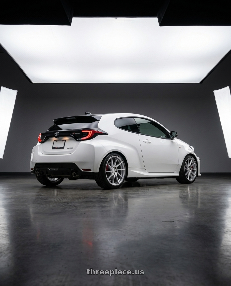 2021 Gr Yaris with Aodhan AH09 5x114.3 18x8.5 +35 Gloss Silver Machined Face wheels rear three quarter view square tires