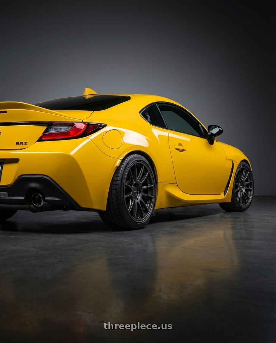 2026 Subaru BRZ Series.Yellow with Enkei GTC01-RR 5x114.3 18x8.5+35 Matte Gunmetal wheels rear three quarter view square tires