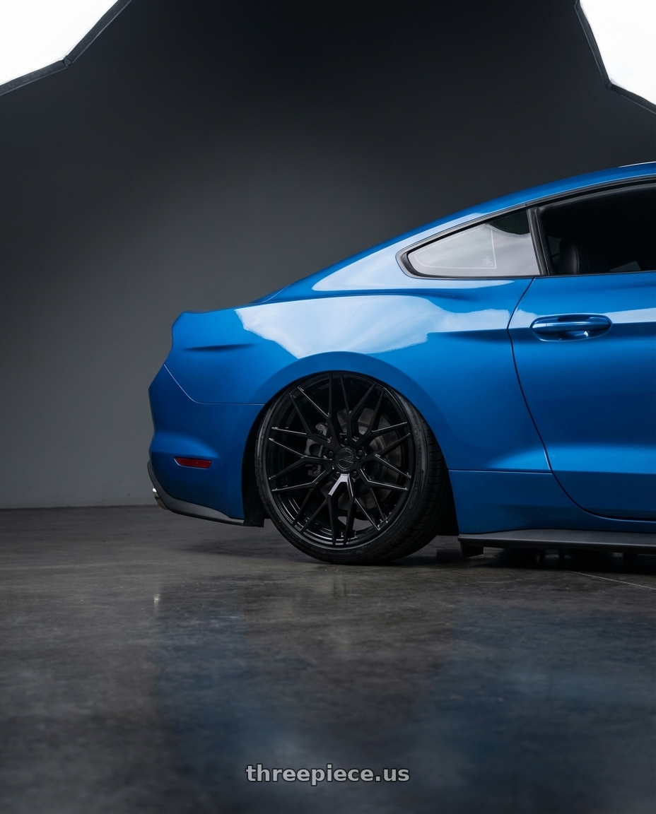 2022 Ford Mustang GT with Avant Garde Wheels M520R 5X114.3 20x10 +35 Gloss Black wheels rear three quarter view slight stretch tires