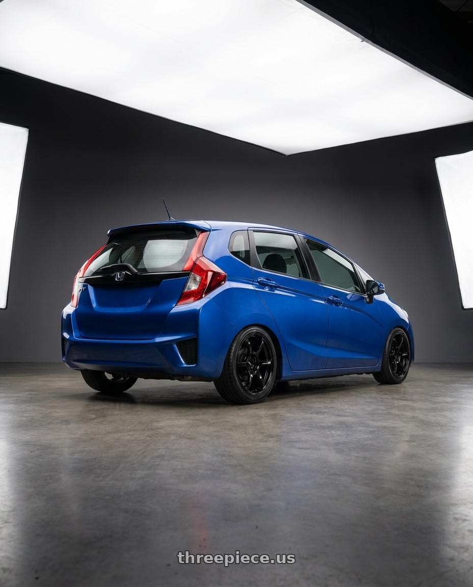 2015 Honda Fit Bule with Advan RGIII 4x100 18x7.0+42 Gloss Black wheels rear three quarter view square tires