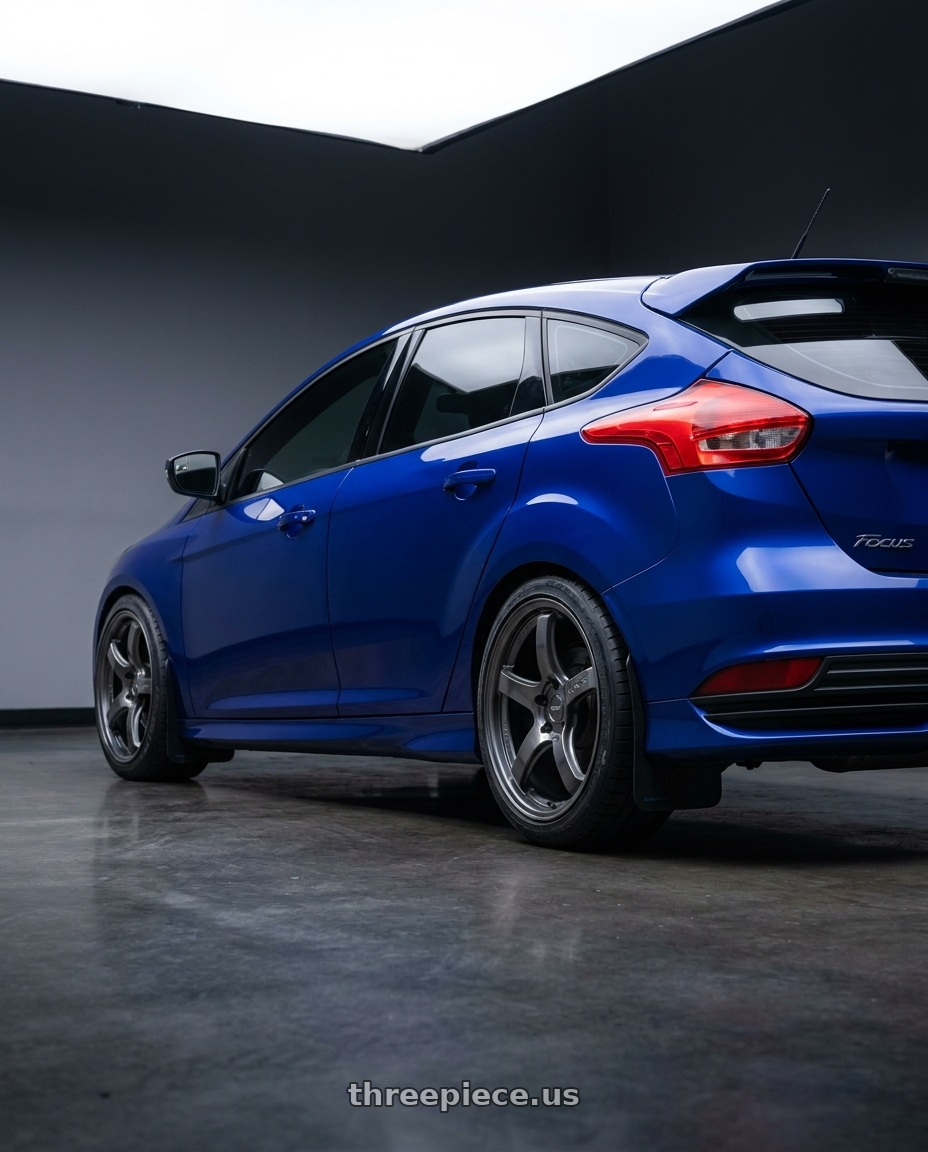 2016 fORD FOCUS ST with Gram Lights 57CR 5x108 18x8.5 +37 HS GUNMETALLIC wheels rear three quarter view square tires