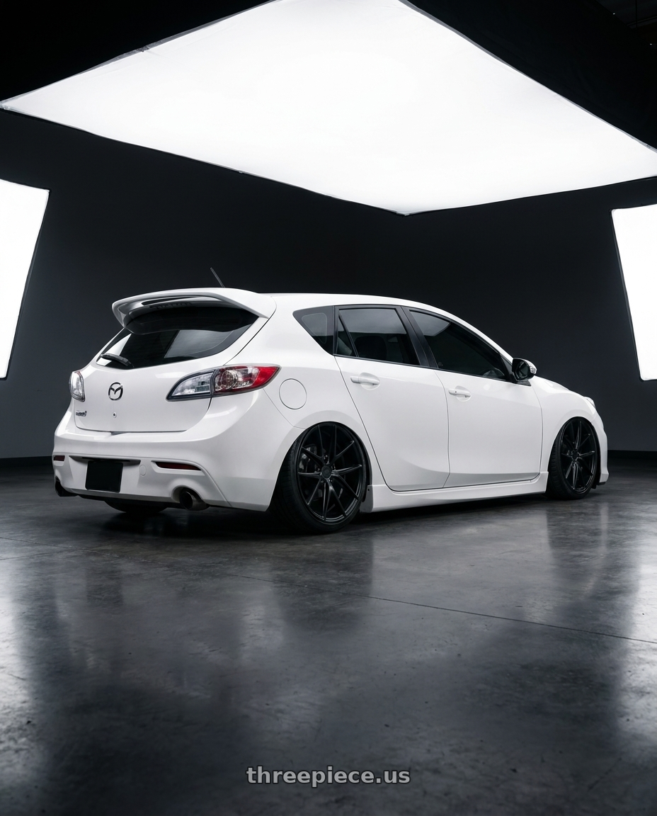 2012 Mazda Mazdaspeed3 with Niche 1PC M117 MISANO 5X114.3 18X8 +42 MATTE BLACK wheels rear three quarter view slight stretch tires
