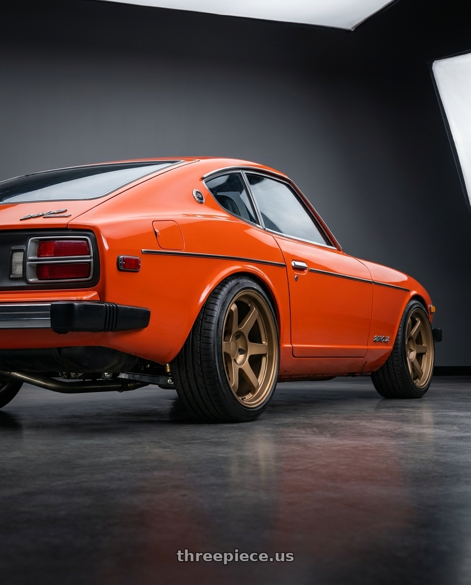 1978 Datsun 280z orange  with 9six9 SIX-1 5x114.3 18X10 +20 Matte Bronze wheels rear three quarter view square tires