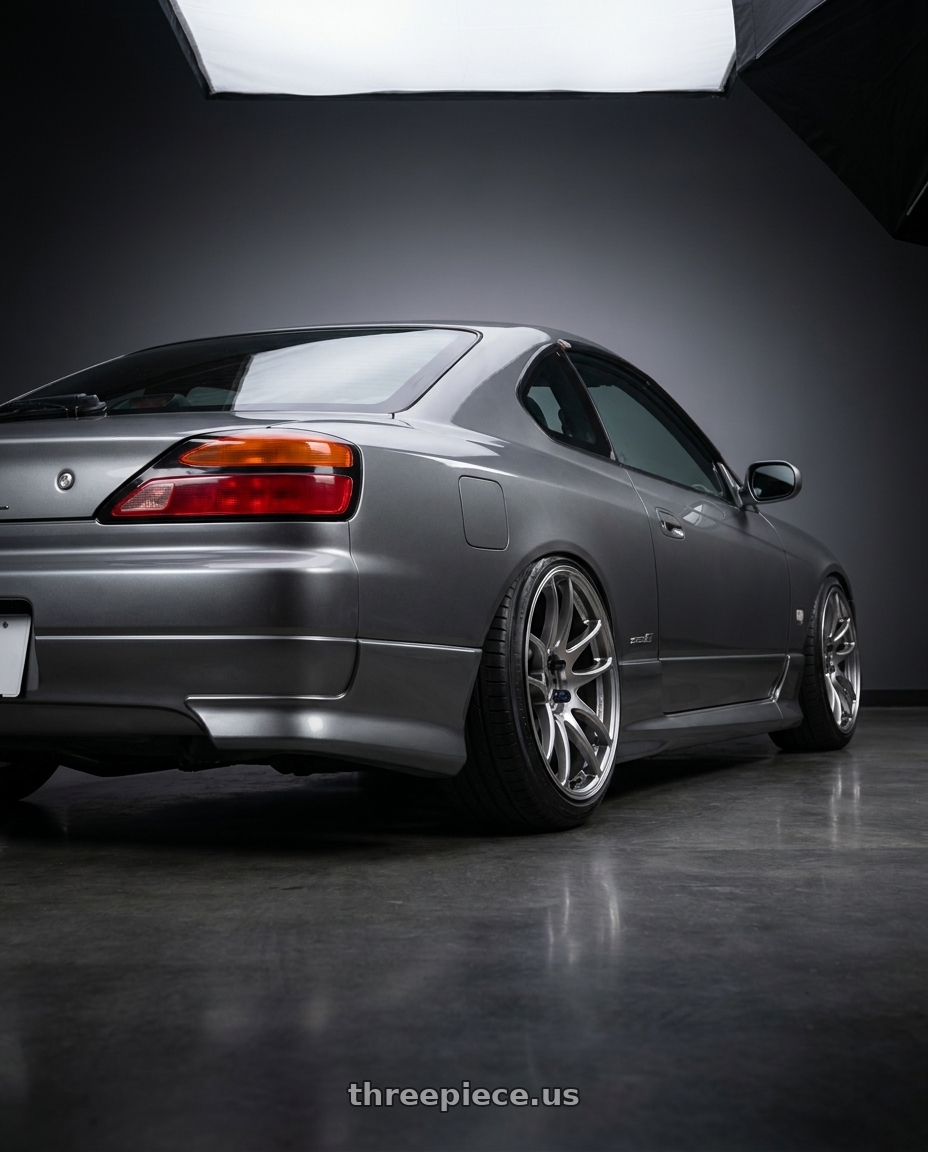 2002 Nissan S15 with Work Emotion Cr Kiwami 5x100 18x9.5 +0 Gt Silver wheels rear three quarter view slight stretch tires