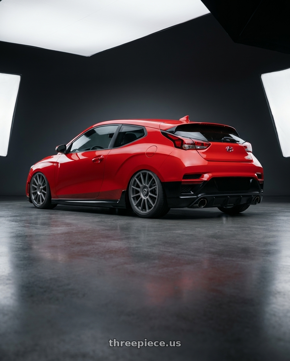 2022 Hyundai Veloster N with fifteen52 PODIUM 5x114.3 / 5x120 19x8.5 +35 FROSTED GRAPHITE (SATIN GREY) wheels rear three quarter view slight stretch tires