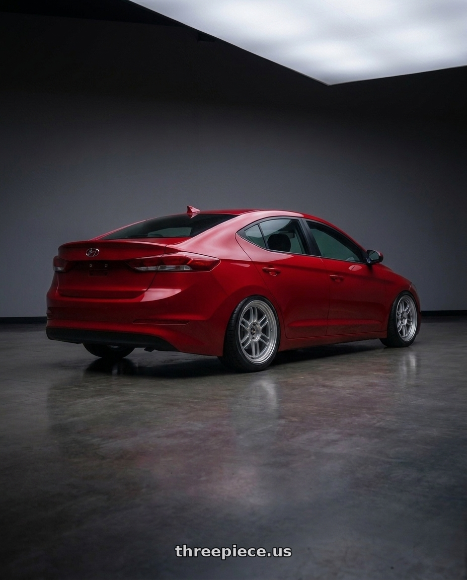 2017 Hyundai Elantra with Enkei RPF1 5x112 17x8+45 Silver wheels rear three quarter view extreme stretch tires