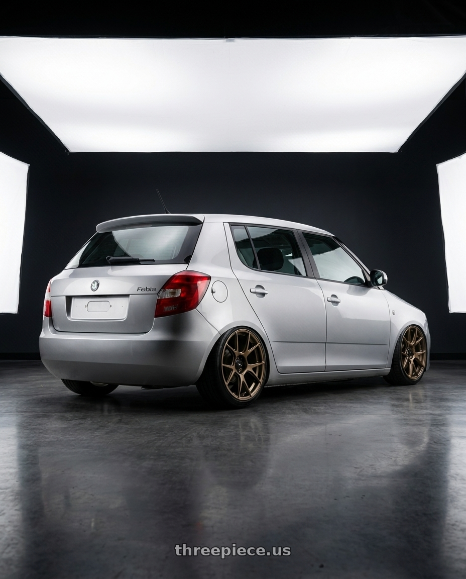 2012 Skoda fabia with Konig Ampliform 5x114.3 19x10.5+23 Gloss Bronze wheels rear three quarter view slight stretch tires