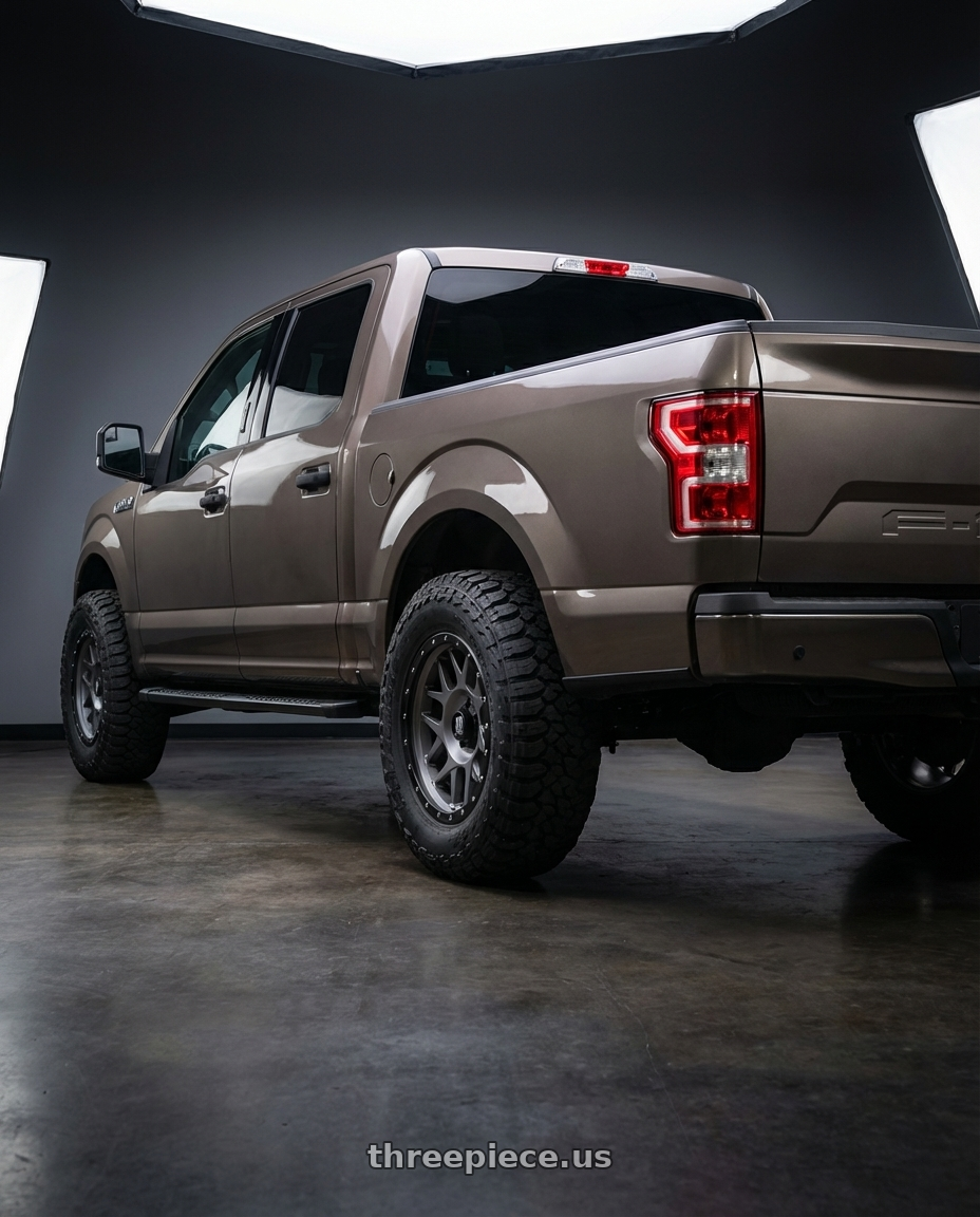 2019 Ford F-150 with XD XD127 BULLY 6X135 20X9 +0 MATTE GRAY BLACK RING wheels rear three quarter view meaty tires