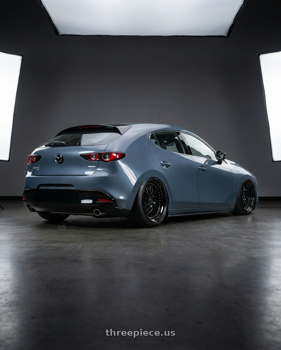 2023 Mazda Mazda3 Turbo with Aodhan DS03 5x114.3 18x9.5 +30 Black Vacuum w/ Gold Rivets wheels rear three quarter view slight stretch tires
