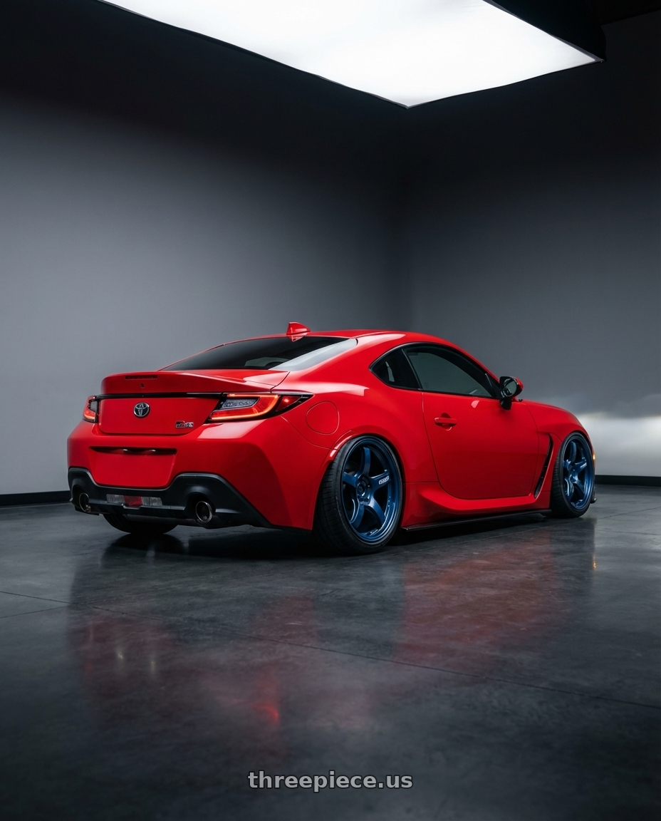 2024 Toyota GR86 with Gram Lights 57CR 5x114.3 18x9.5+12 Eternal Blue Pearl wheels rear three quarter view slight stretch tires