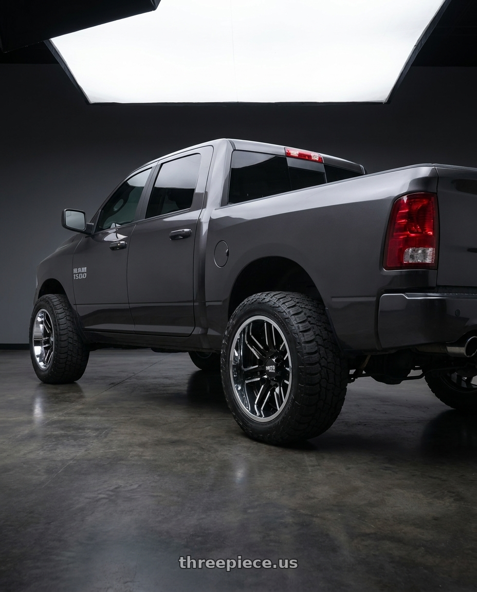 2024 Ram 1500 with Moto Metal MO202 6X139.7 22X10 -18 GLOSS BLACK MACHINED CENTER CHROME LIP wheels rear three quarter view meaty tires