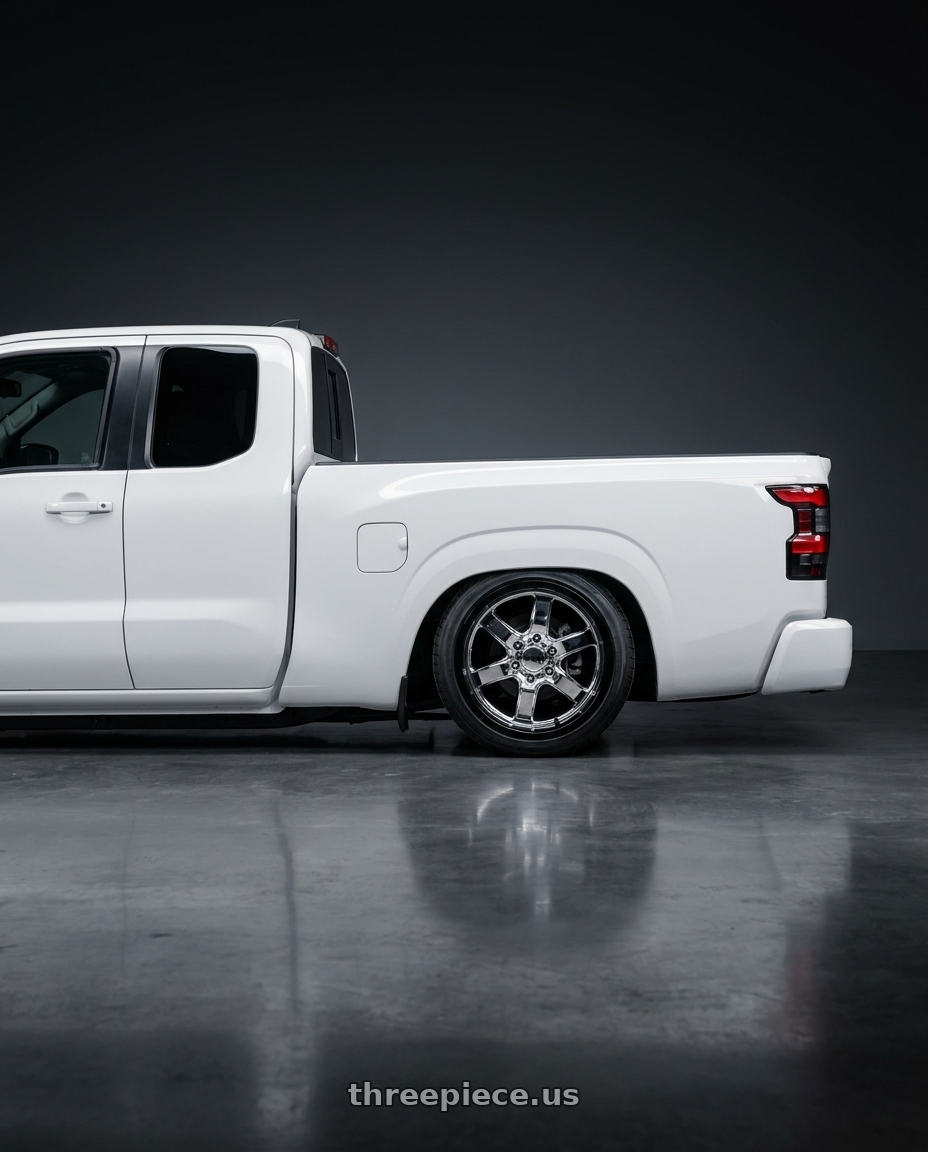 2025 nissan frontier king cab with Moto Metal MO200 5X127 20X10 -18 CHROME CENTER GLOSS BLACK MILLED LIP wheels rear three quarter view slight stretch tires