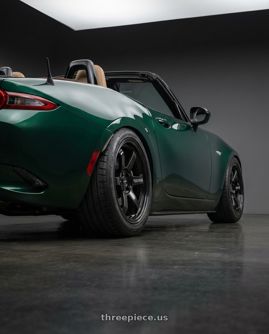 2016 Mazda mx5 racing green with Volk Racing TE37 SONIC 4x100 16x7+25 wheels rear three quarter view meaty tires