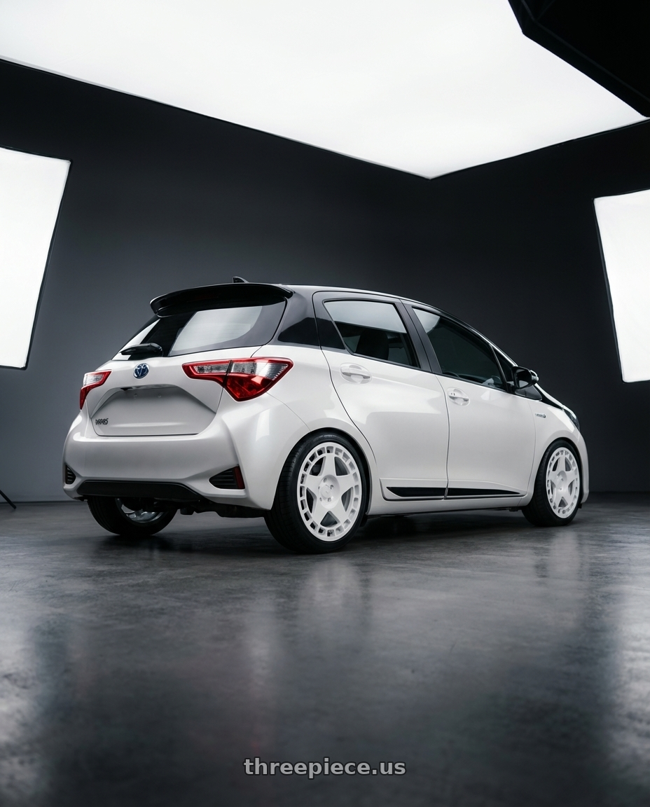 2020 Toyota Yaris Y20 with fifteen52 TURBOMAC 5x112 18x8.5 +45 RALLY WHITE (GLOSS WHITE) wheels rear three quarter view square tires