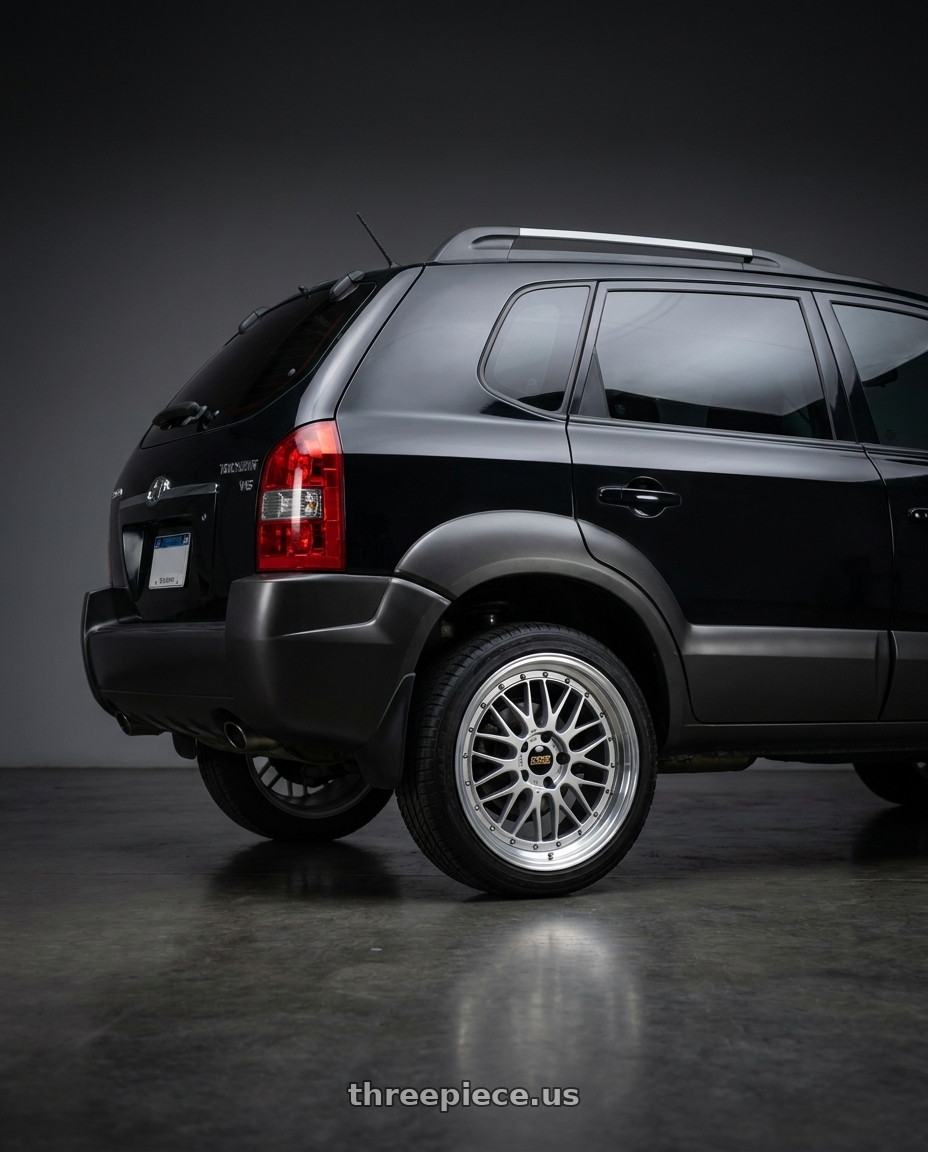 2009 Hyundai Tucson V6 Black with BBS LM 5x114.3 17x7.5+38 Diamond Silver wheels rear three quarter view square tires