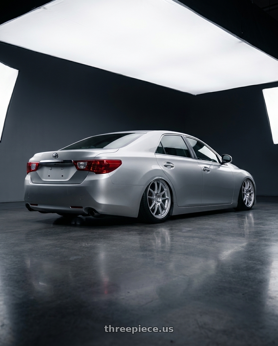 2014 Toyota reiz with Enkei PF01 5x114.3 18x8.5+35 Silver wheels rear three quarter view slight stretch tires