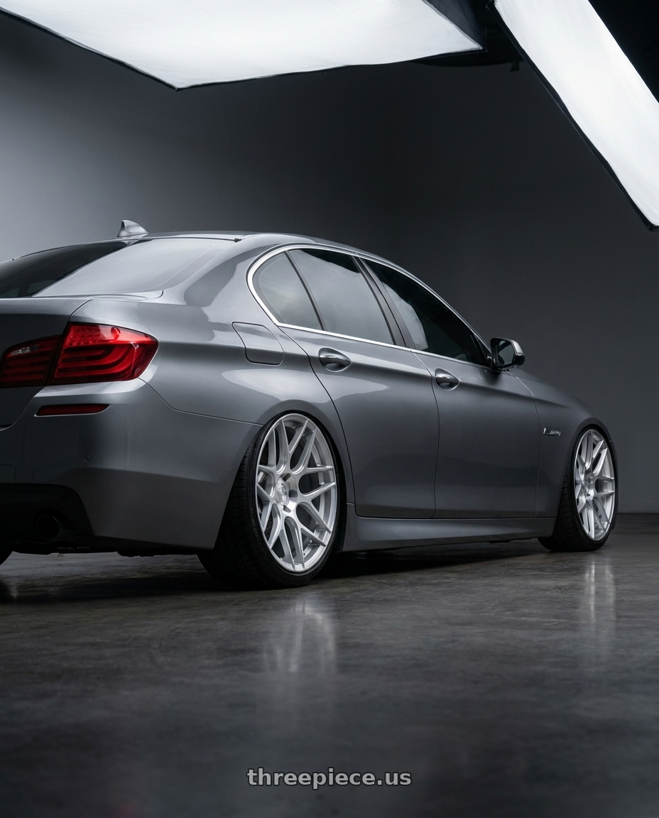 2016 BMW 5 Series F10 with Aodhan AFF2 5x120 19x8.5+35 Gloss Silver Machined Face wheels rear three quarter view slight stretch tires