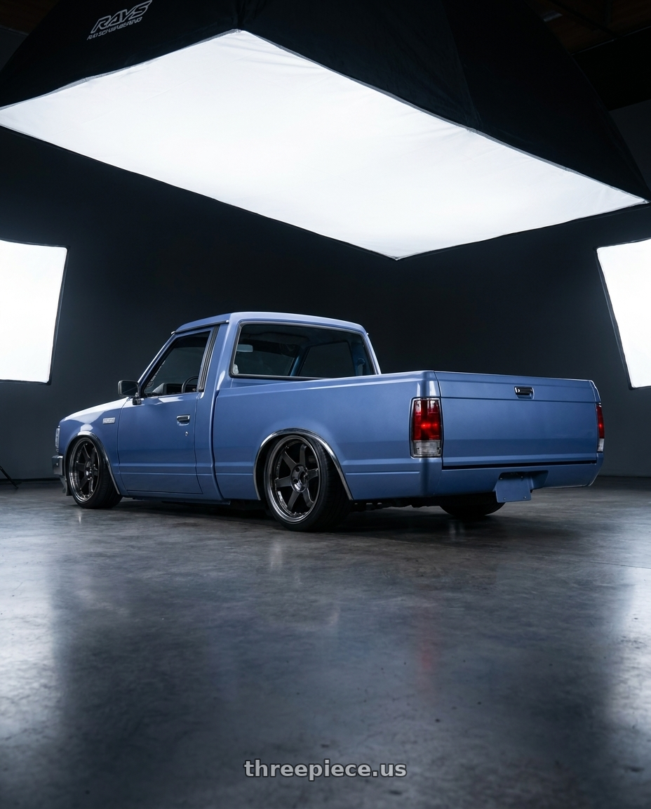 1986 nissan 720 with Volk Racing TE37SL 5x114.3 19x10.5+12 Pressed Double Black wheels rear three quarter view slight stretch tires