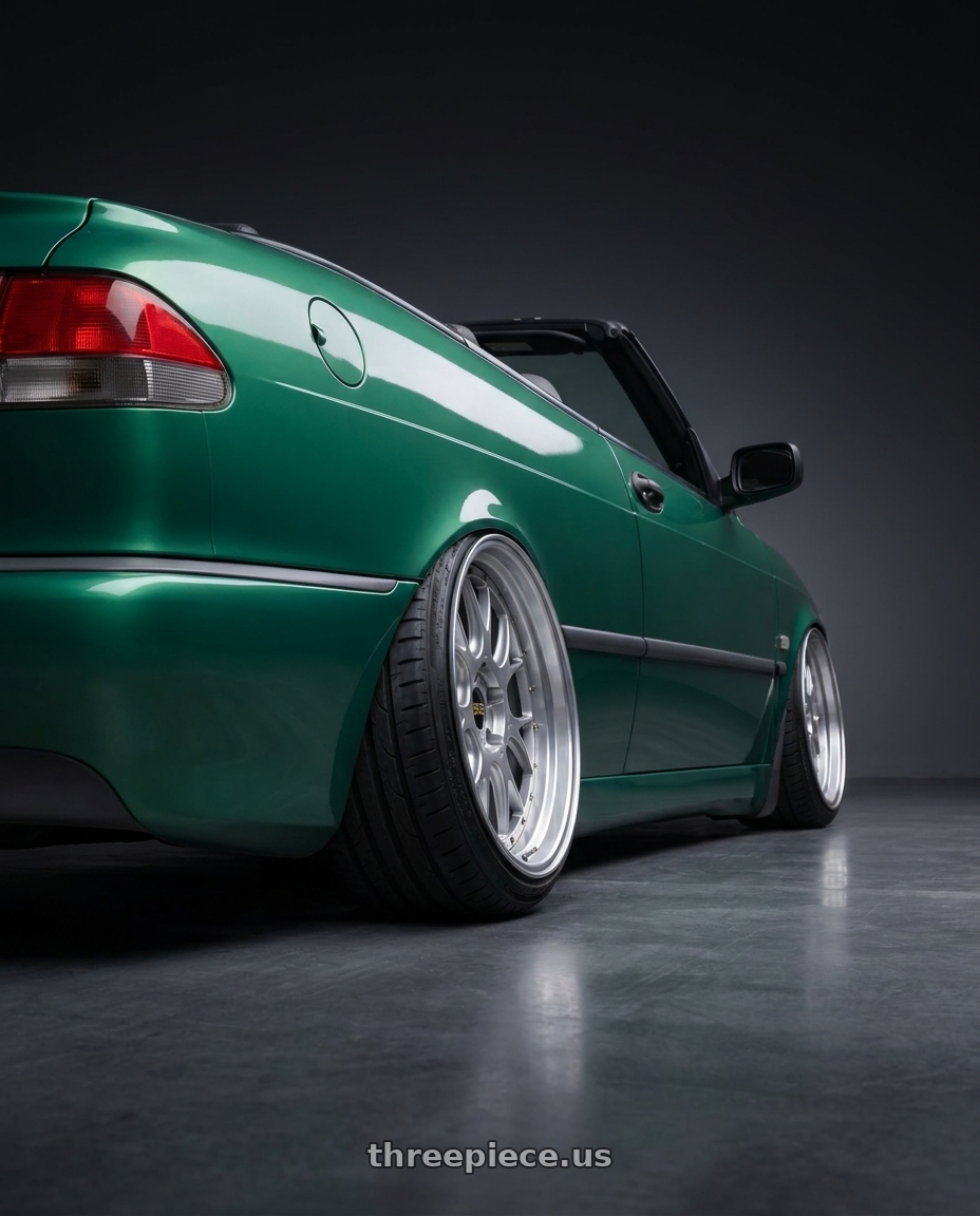 1999 Saab 9-3 with BBS LM-R 5x114.3 19x9.5+45 Diamond Silver wheels rear three quarter view extreme stretch tires