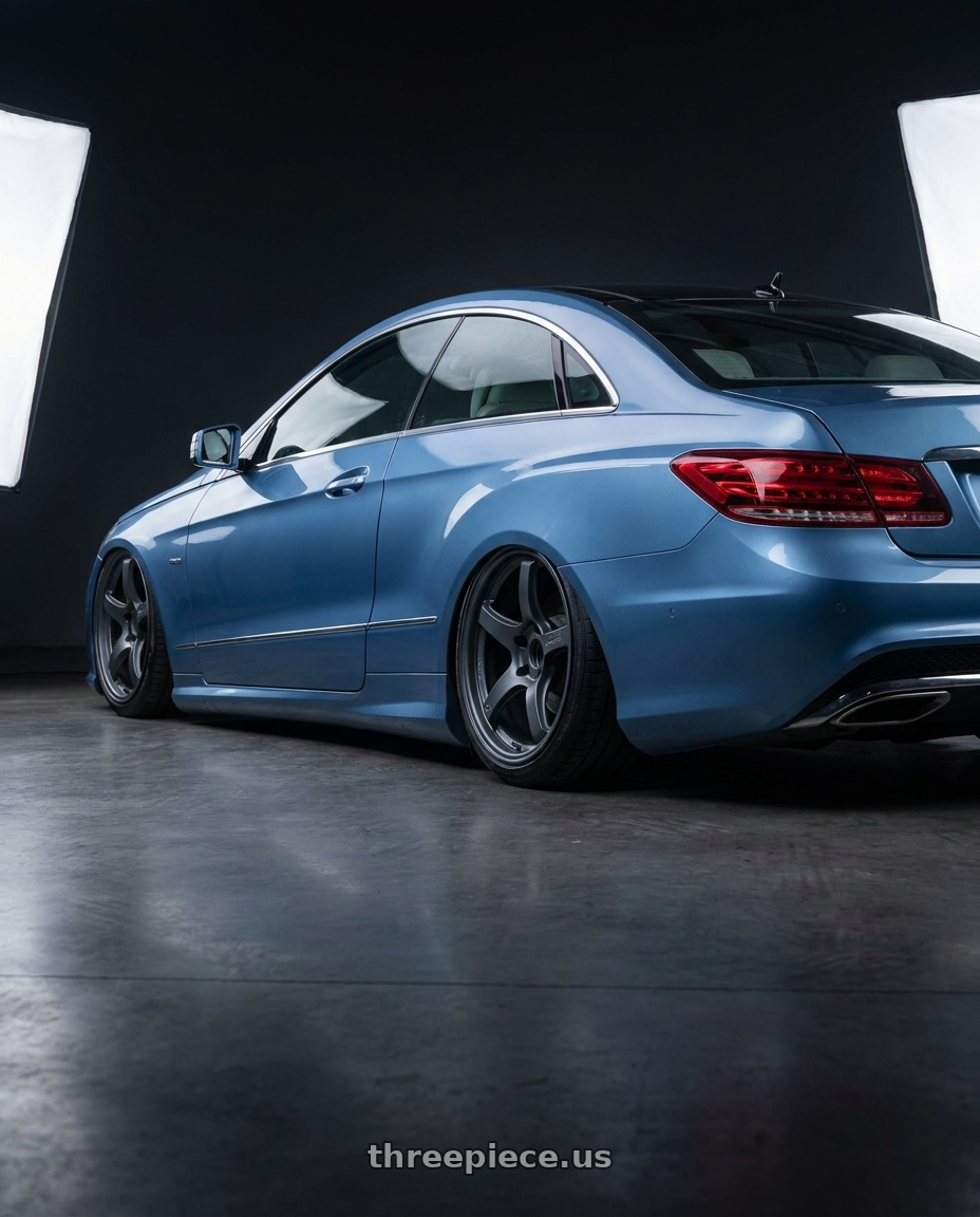 2014 Mercedes-Benz E-Class Coupe C207 with Gram Lights 57CR 5x112 19x9.5+25 Gunblue II wheels rear three quarter view slight stretch tires