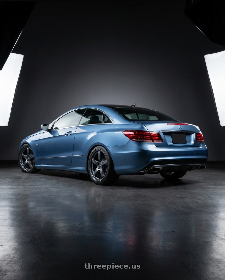 2014 Mercedes-Benz E-Class Coupe C207 with Gram Lights 57CR 5x112 19x9.5+25 Gunblue II wheels rear three quarter view square tires