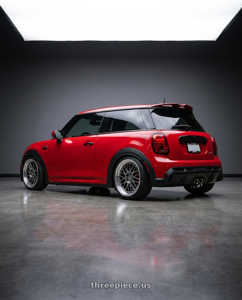 2025 mini jcw red with Aodhan AH02 5x112 19x9.5 +35 Hyper Black w/ Machined Lip wheels rear three quarter view slight stretch tires