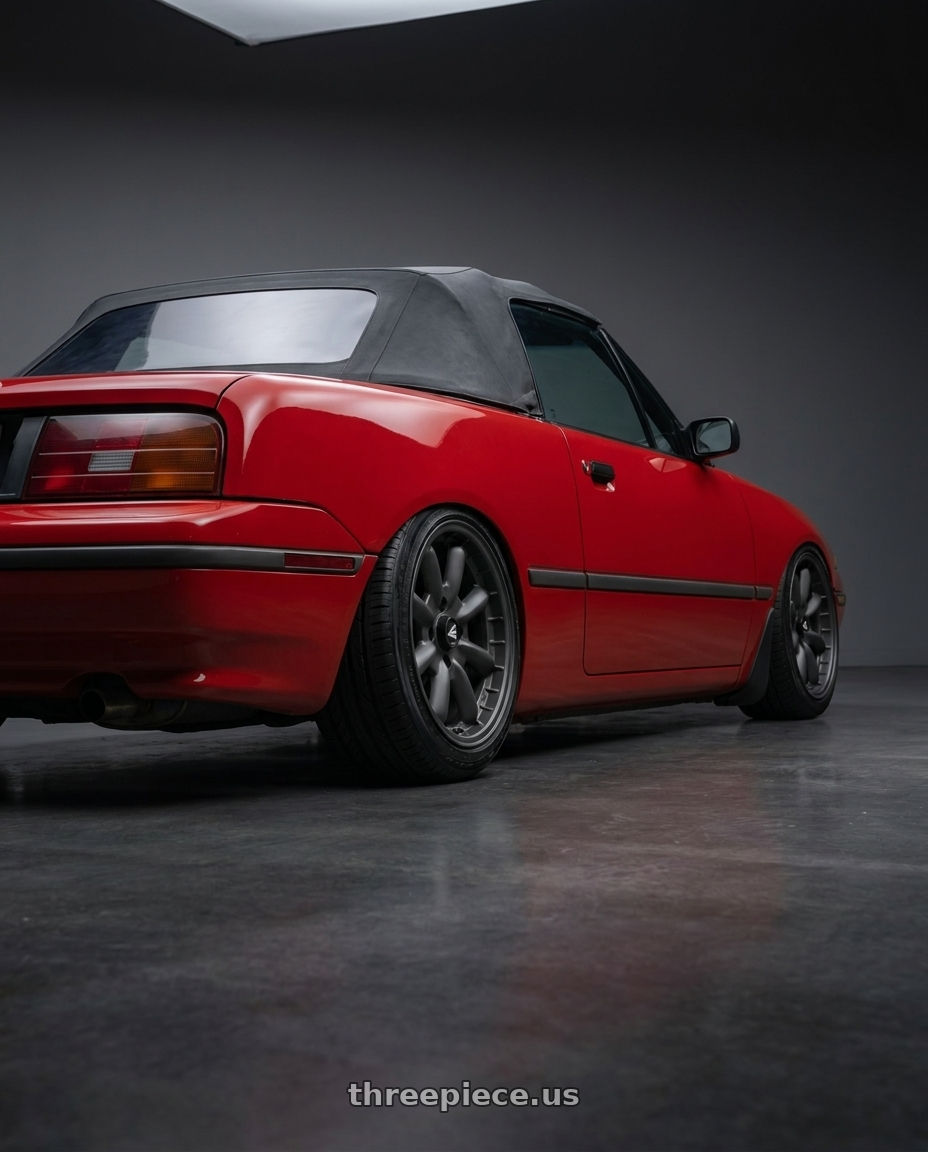 1991 Mercury capri with Enkei Compe 4x100 15x7+38 Matte Gunmetal wheels rear three quarter view slight stretch tires