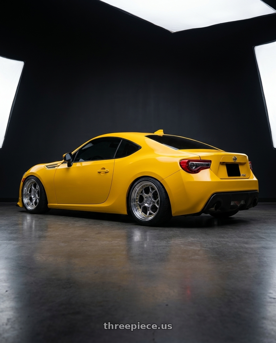 2015 SCION FRS with Aodhan DS01 5x100 18x9.5+35 Vacuum Chrome W/ Gold Rivets wheels rear three quarter view meaty tires