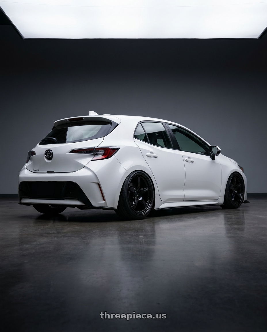 2023 Toyota Corolla Hatchback with Gram Lights 57CR 5x114.3 18x8.5+37 Glossy Black wheels rear three quarter view slight stretch tires