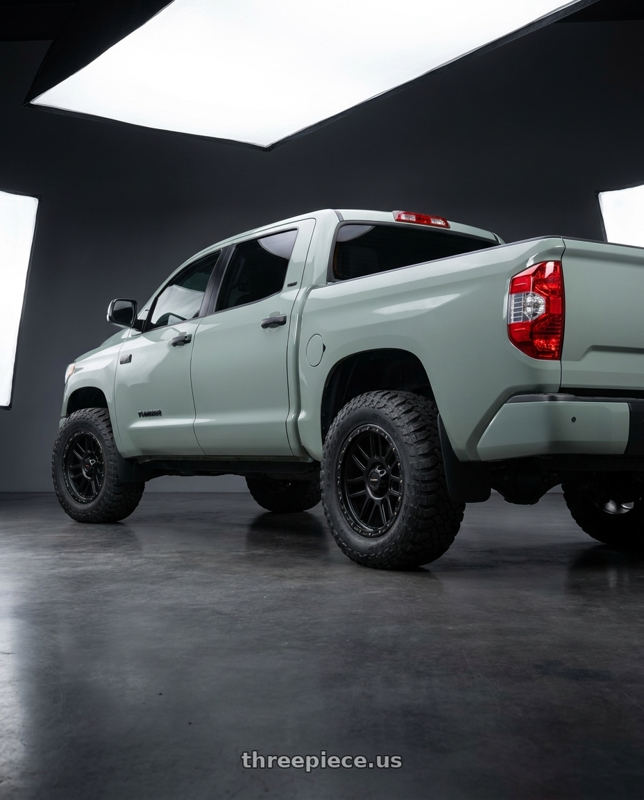 2018 Toyota Tundra with Vision Off-Road 111 Nemesis 5x150 20x9+18 Matte Black wheels rear three quarter view meaty tires