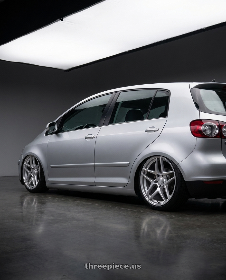 2006 Volkswagen Golf with Kansei K15H Astro 5X112 19x8.5 35 Hyper Silver wheels rear three quarter view slight stretch tires
