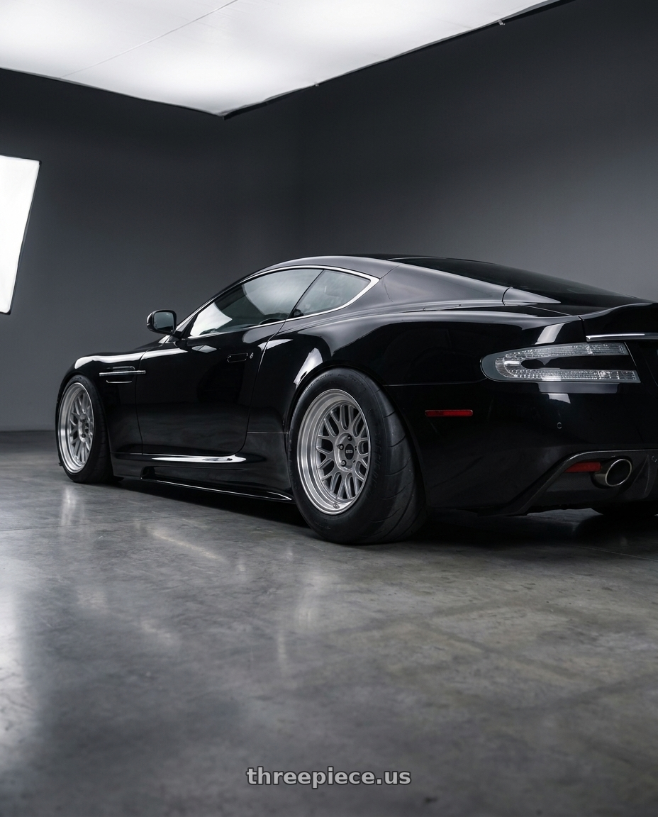 2009 Aston Martin DBS Black with ESR Wheels CR SERIES CR01 5x100 18x8.5 +30 Hyper Silver wheels rear three quarter view excessive tires