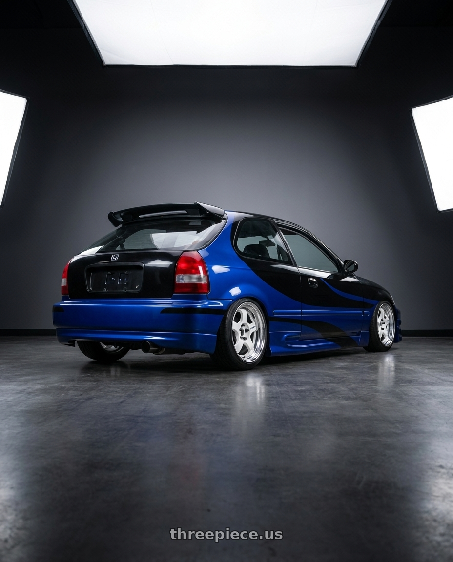 1999 Honda Civic Hatch DX, black and blue  with Work Meister S1 2P 4x100 15x6.5+38 R Disk White wheels rear three quarter view square tires