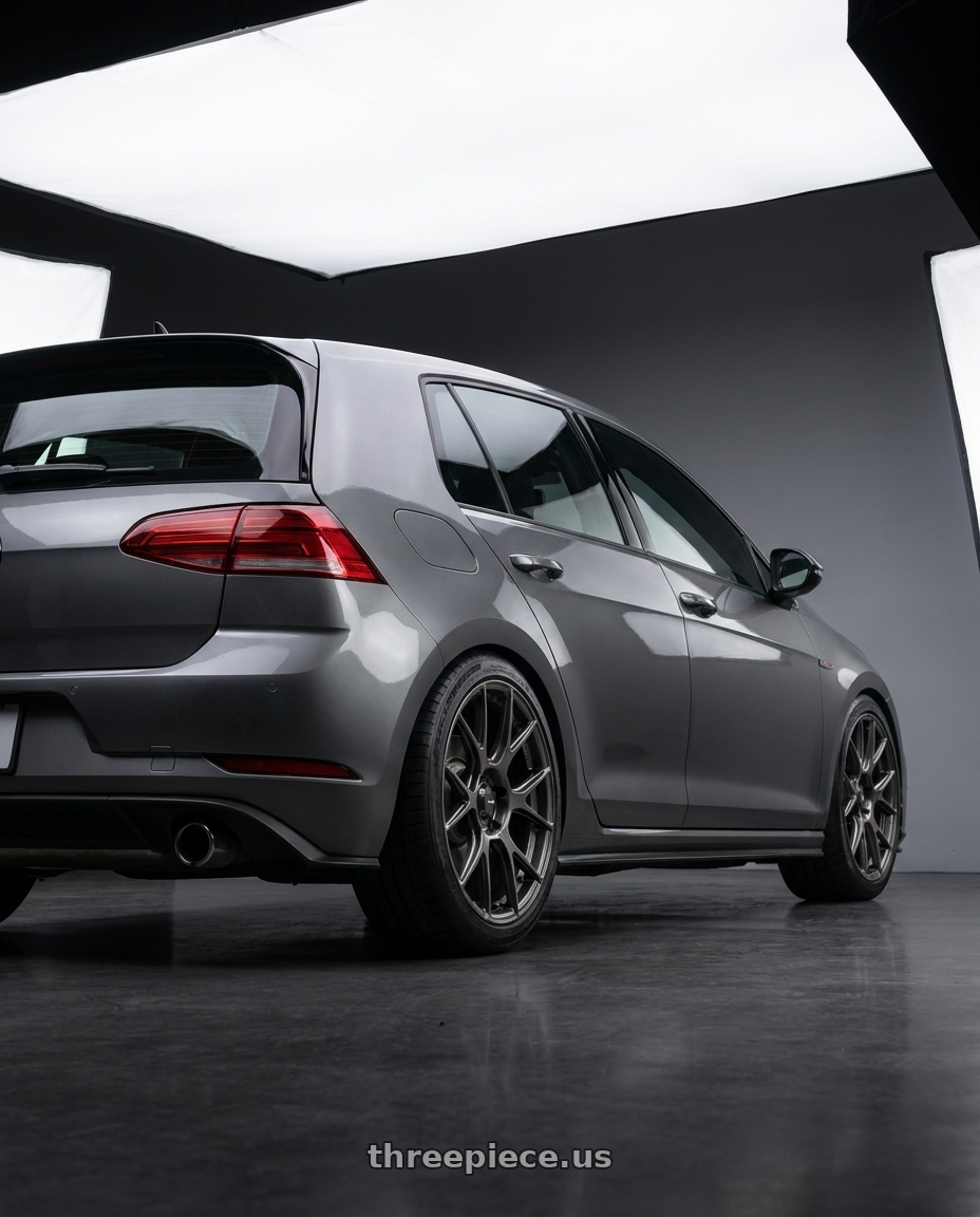 2019 Volkswagen GTI MK7 with Konig Ampliform 5x112 18x8.5+43 Dark Metallic Graphite wheels rear three quarter view square tires