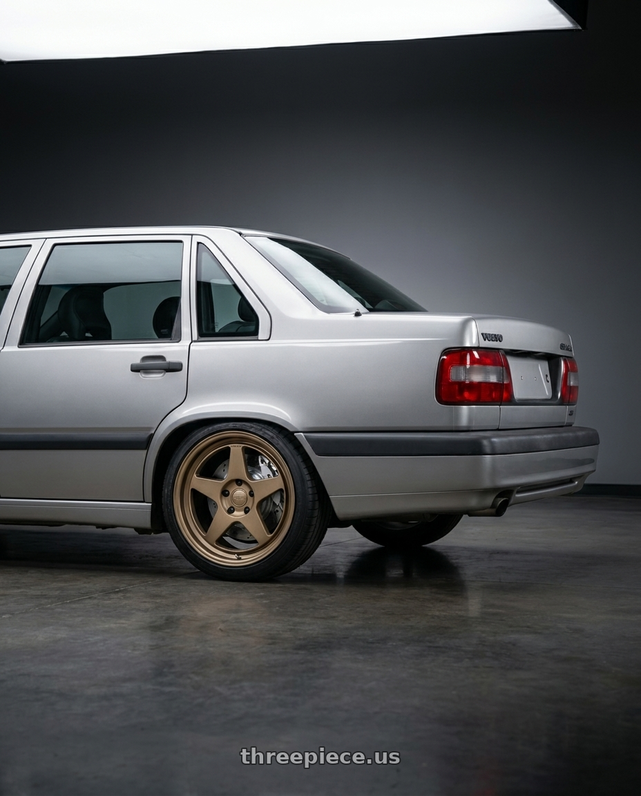 1996 Volvo 850 GLE, Silver, Big brake kit silver 6 piston calipers. with Kansei K12B KNP 5X108 18x8.5 35 Bronze wheels rear three quarter view square tires