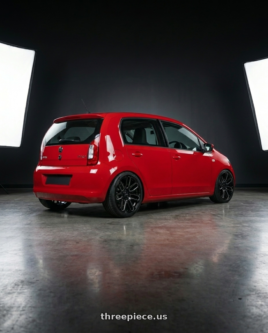 2015 skoda citigo with Petrol P2B 4X114.3 15X7 +40 GLOSS BLACK wheels rear three quarter view slight stretch tires