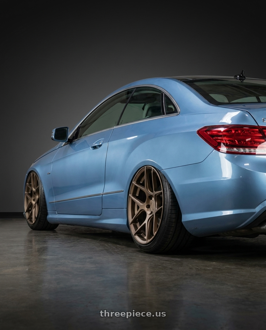 2014 Mercedes-Benz E-Class Coupe C207 with Aodhan AFF2 5x112 20x10.5+35 Matte Bronze wheels rear three quarter view slight stretch tires