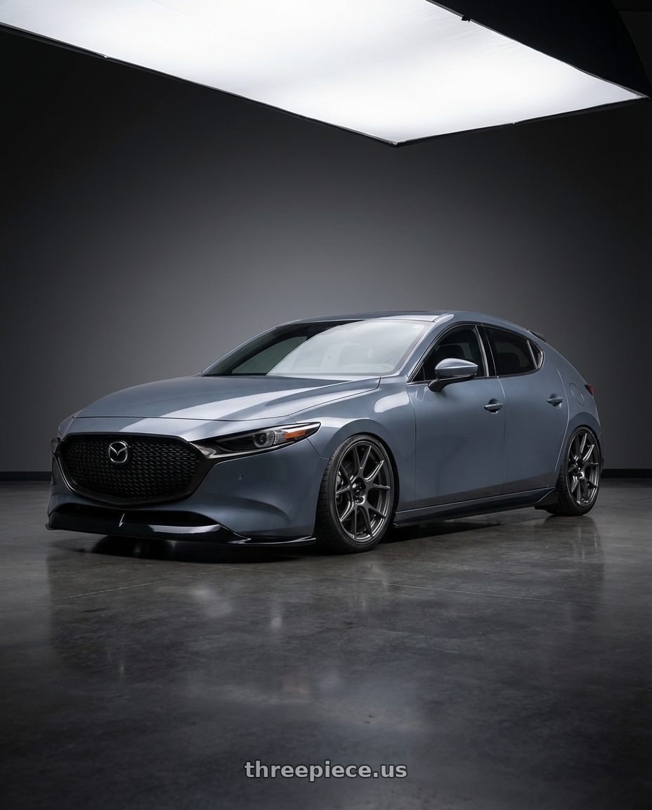 2023 Mazda Mazda3 Turbo with Konig Ampliform 5x114.3 18x10+20 Dark Metallic Graphite wheels front three quarter view stanced stance