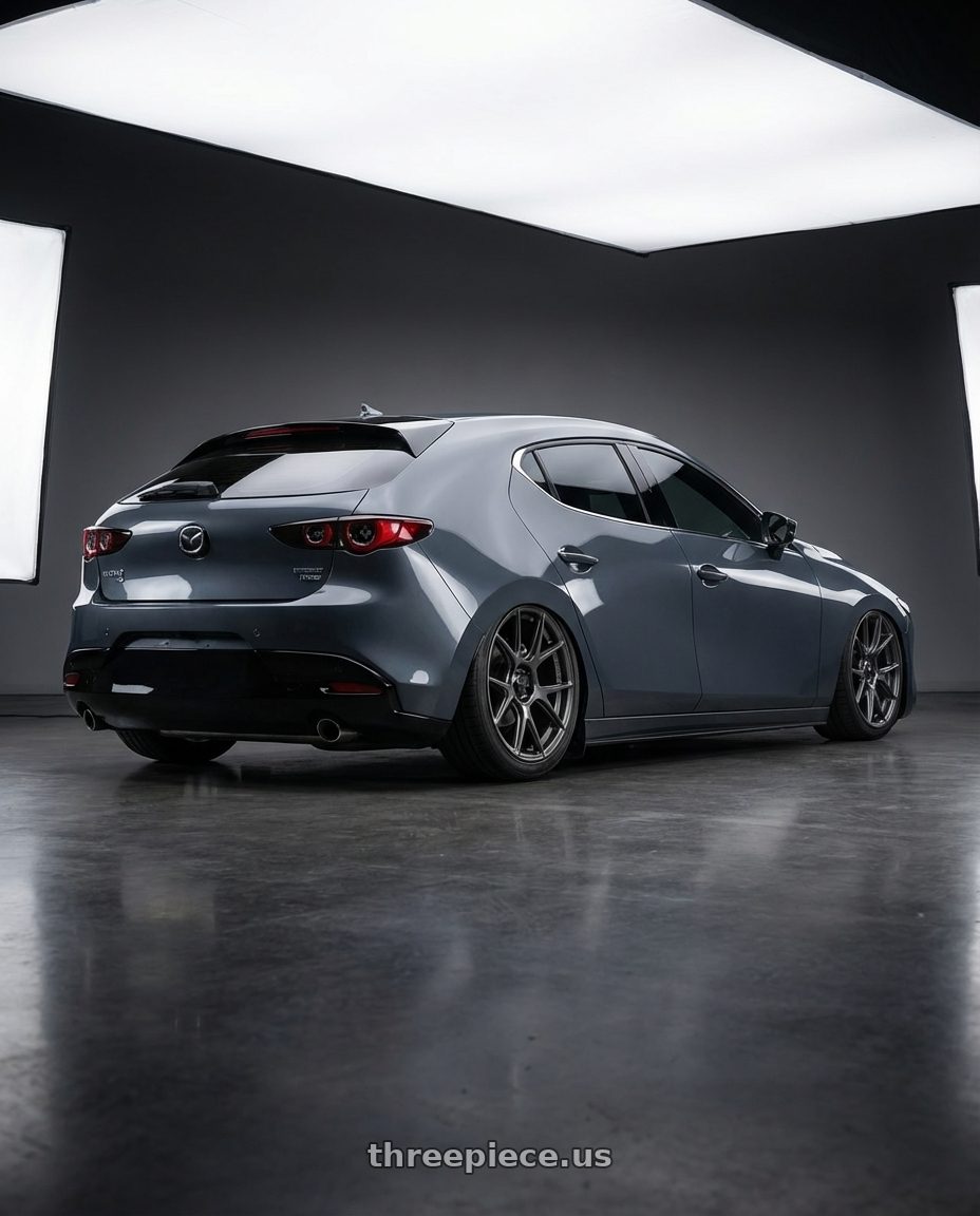 2023 Mazda Mazda3 Turbo with Konig Ampliform 5x114.3 18x10+20 Dark Metallic Graphite wheels rear three quarter view slight stretch tires