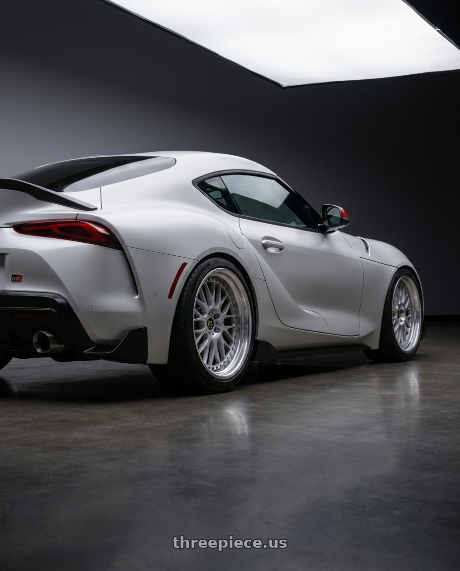 2026 Toyota GR Supra final with Work Vs-Xx 5x100 18x11-29 R Disk Light Grey Silver wheels rear three quarter view square tires