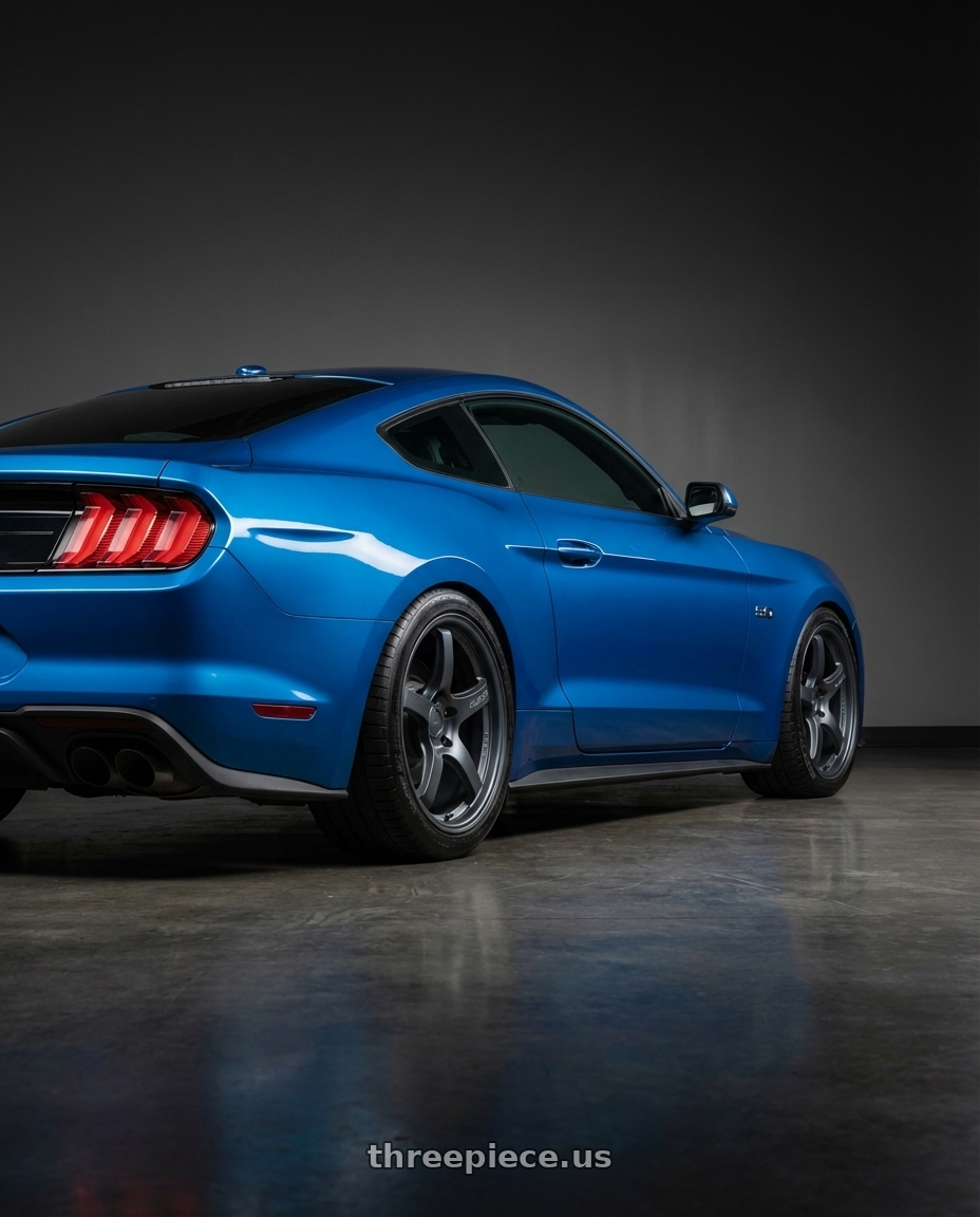 2022 Ford Mustang GT with Gram Lights 57CR 5x114.3 19x10.5+35 Gunblue II wheels rear three quarter view square tires