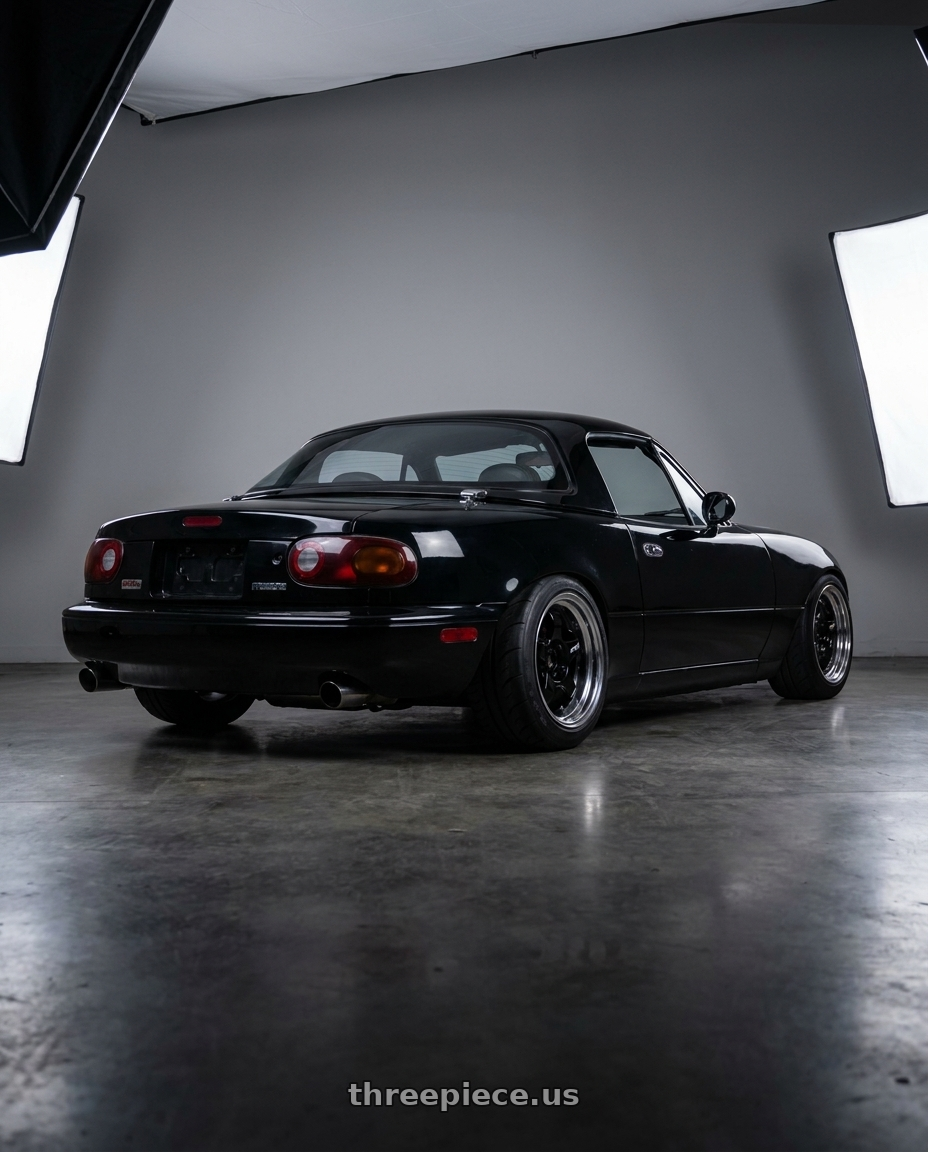 1995 Mazda miata with Work Meister S1 2P 4x100 15x9+12 O Disk Black wheels rear three quarter view meaty tires
