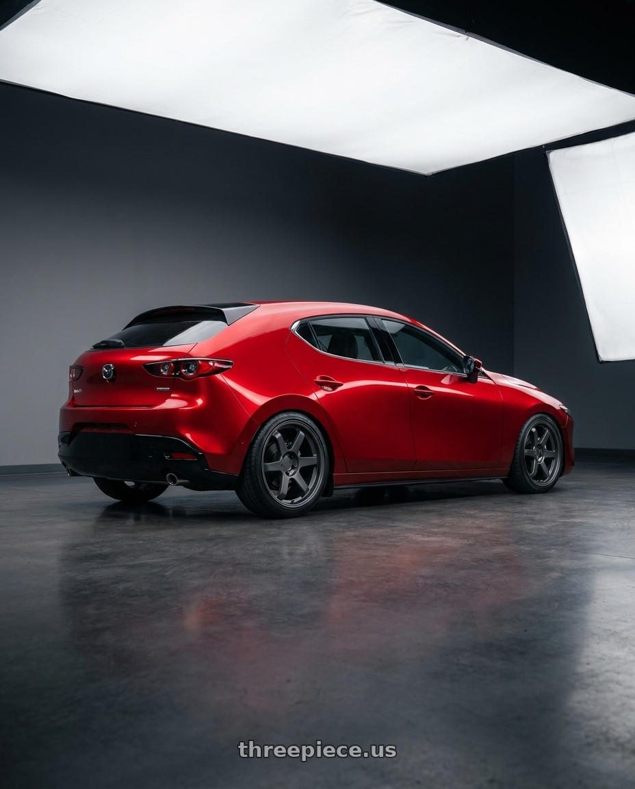 2024 Mazda 3 with 9six9 SIX-1 5x120 19X8.5 +35 Carbon Gray wheels rear three quarter view slight stretch tires