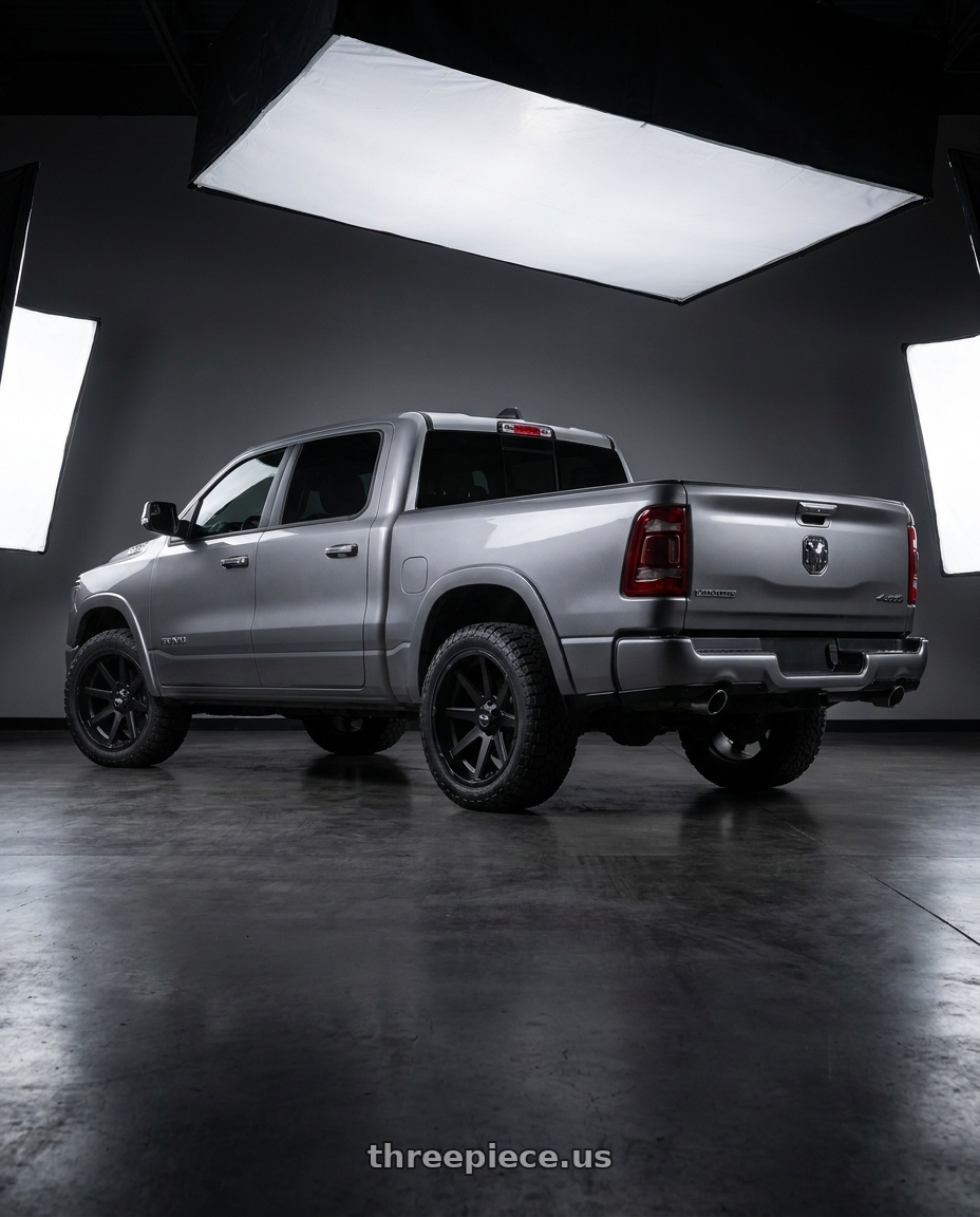 2021 Ram 1500 Laramie with Ion Type 143 6x139.7 20x9+0 Matte Black wheels rear three quarter view square tires