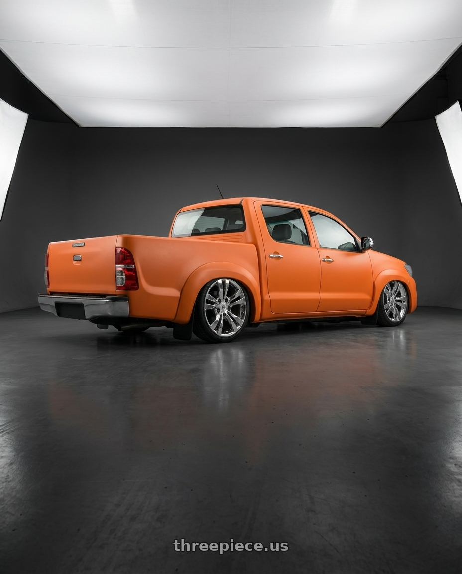 2011 Hilux srv adesivada de laranja with OE Wheels CA15B 5x120 18x8.5+40 Chrome wheels rear three quarter view slight stretch tires